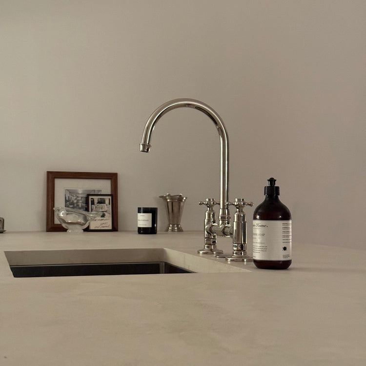 A traditional deck-mounted Francone BT49S solid brass kitchen faucet with a curved swivel spout.