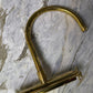 A detail of the solid brass Francone BT49T wall-mounted kitchen tap faucet on a marble surface.