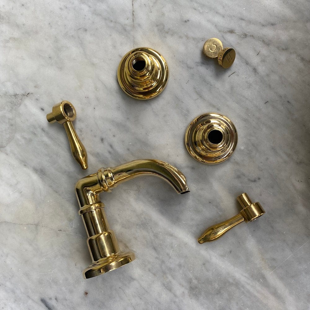 Disassembled components of the traditional Francone BT50 unlacquered brass bathroom bath tap faucet.