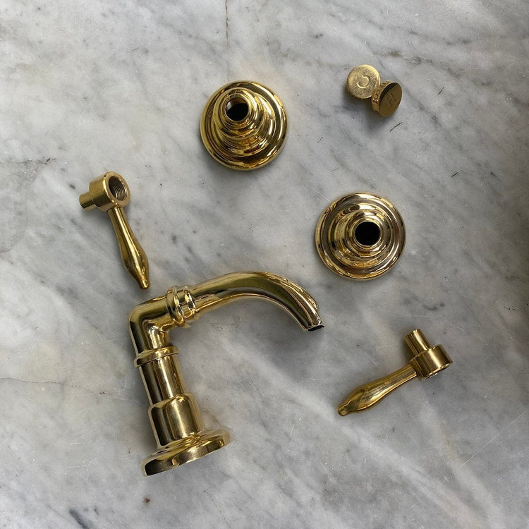Disassembled components of the traditional Francone BT50 unlacquered brass bathroom bath tap faucet.