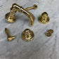 Unlacquered brass components of the Francone BT50 traditional deck-mounted bath tap faucet.