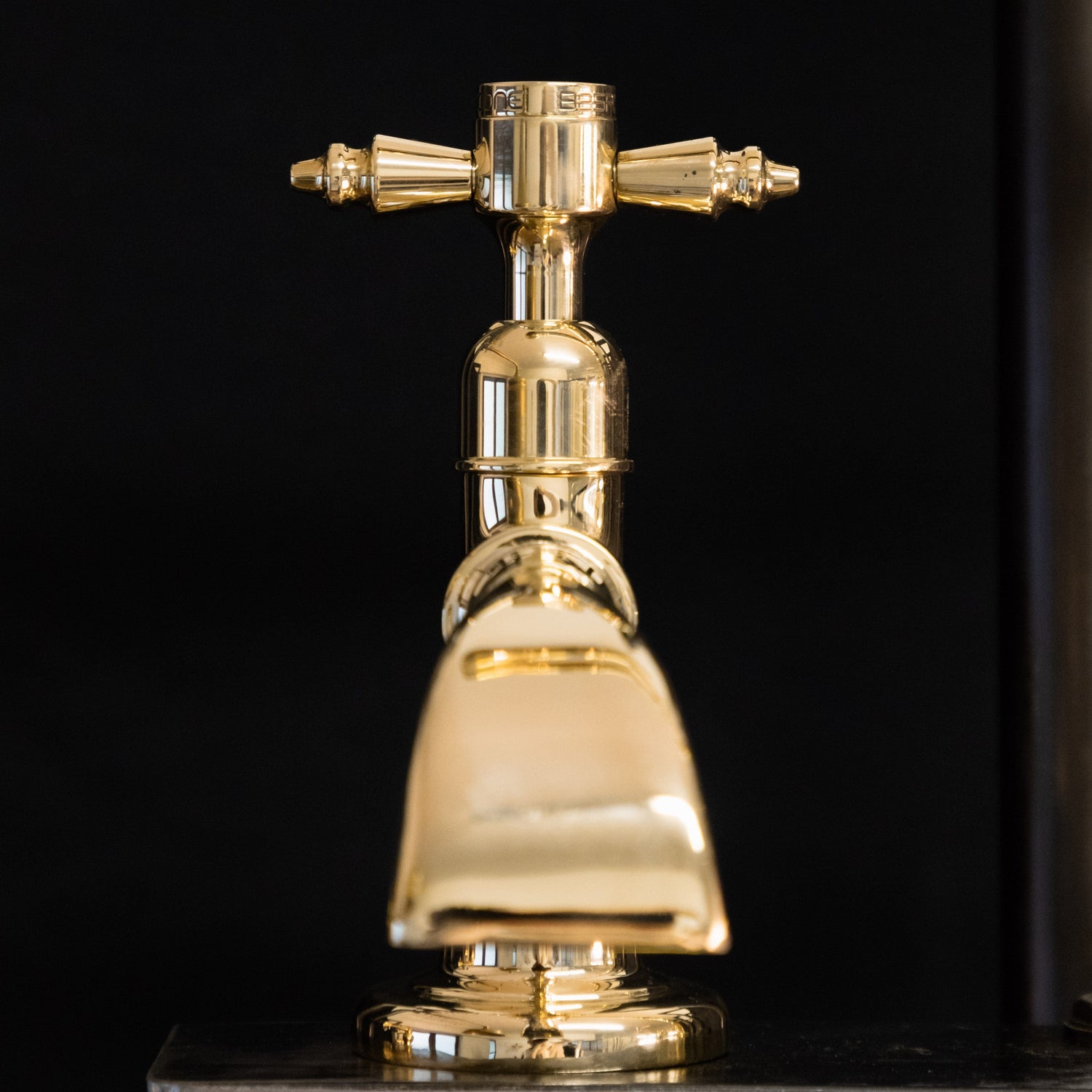 A Francone BT50D solid brass single pillar tap with a decorative waterfall spout for luxury bathrooms.