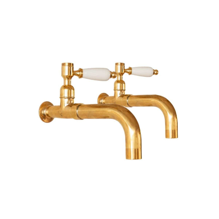 Francone BT59 traditional unlacquered brass wall-mounted taps with white lever handles, a classic bathroom faucet.