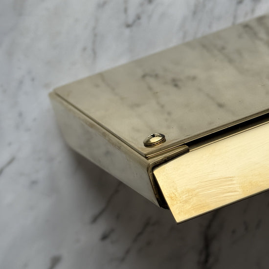 Detail of the Francone BT61M unlacquered brass wall-mounted waterfall faucet spout.