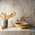 Francone BT65 wall-mounted traditional faucet in solid brass, installed above a yellow stone basin.