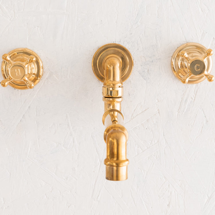 Francone BT70 traditional wall-mounted brass faucet with a swivel spout and crosshead handles.