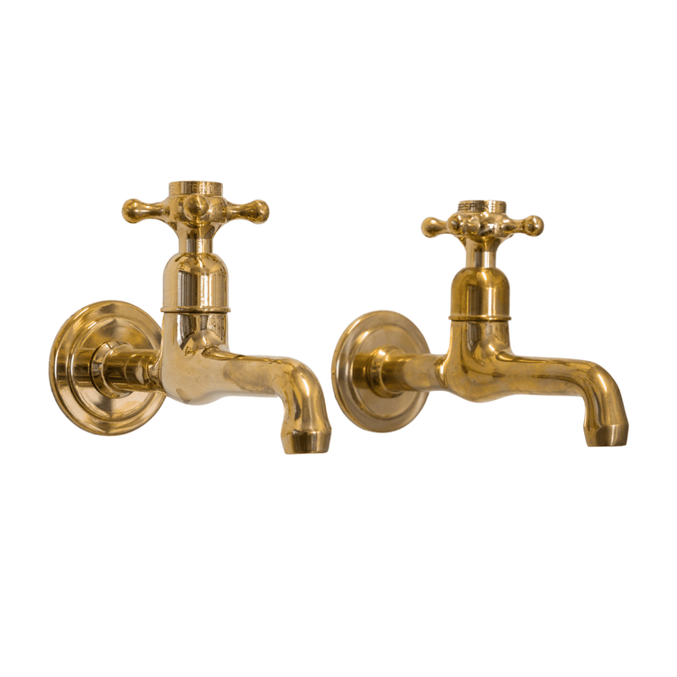 A pair of traditional Francone BT72 wall-mounted solid brass bathroom taps, also called faucets.