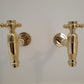 Francone BT73 traditional beer-style bib taps in unlacquered brass, perfect as a wall-mounted bathroom faucet.