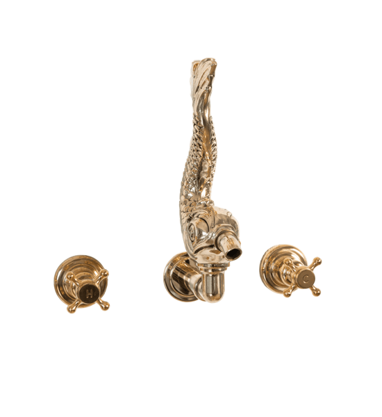 The traditional Francone BT81W wall-mounted unlacquered brass tap features an ornamental fish-shaped spout.