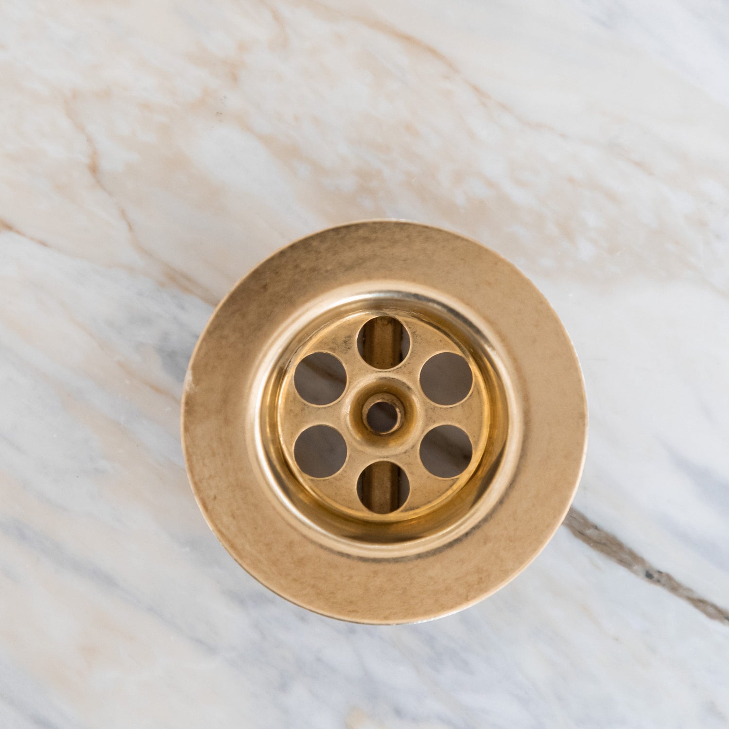 The top view of a Francone BTA2 traditional unlacquered brass bathroom basin drain waste.