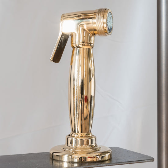 A close-up detail of the Francone BTA22 handcrafted solid brass pull-out spray faucet accessory.