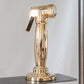 A close-up detail of the Francone BTA22 handcrafted solid brass pull-out spray faucet accessory.