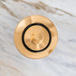 Traditional round Francone BTA2S basin waste plug in unlacquered brass, top-down view.
