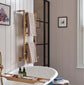 Traditional Francone BTR14 unlacquered brass plumbed heated towel rail installed in a neutral bathroom.