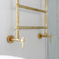 A traditional Francone BTR16 unlacquered brass heated towel rail installed in a bathroom.