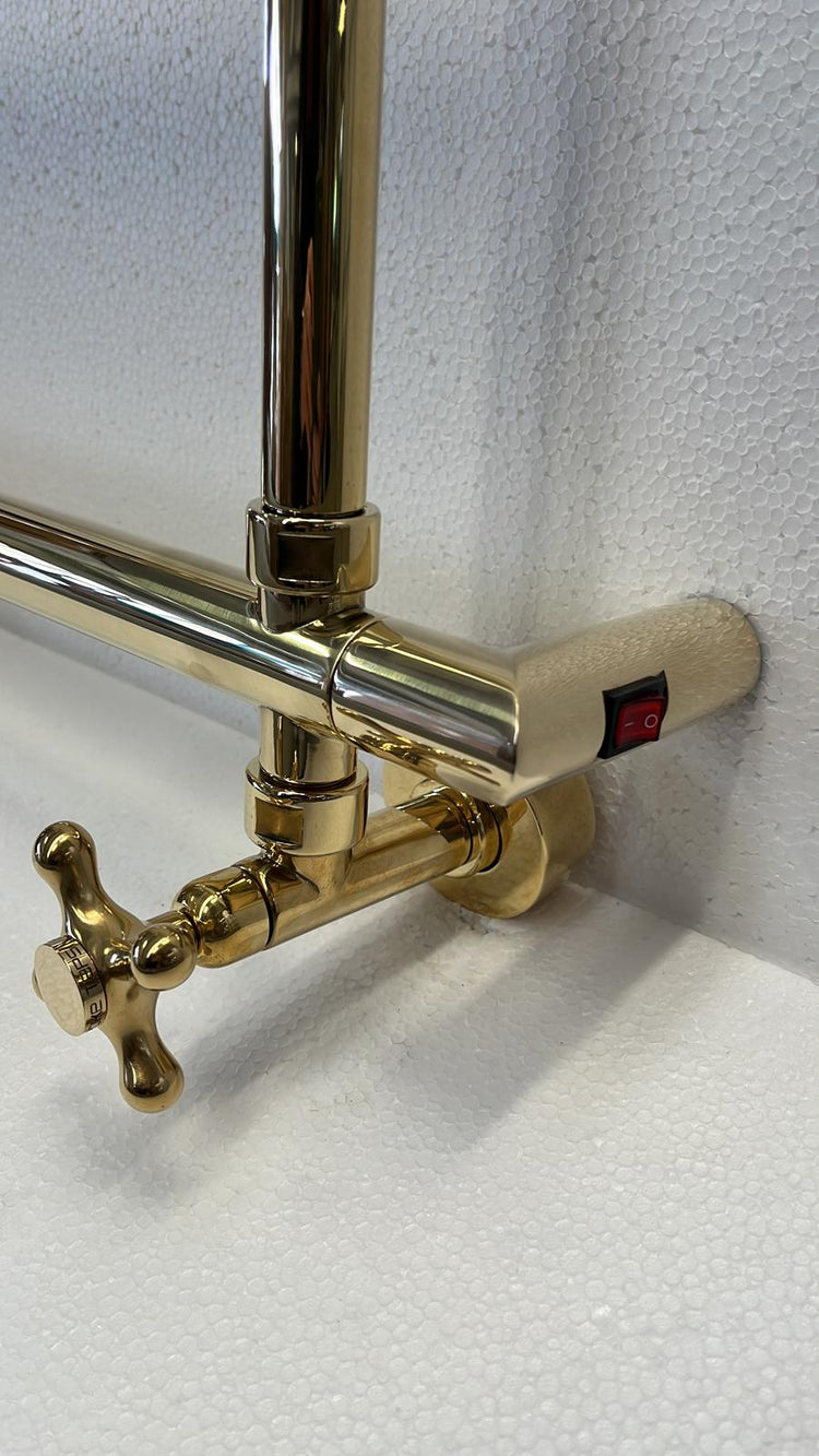 A detail of the solid brass Francone BTR19 dual fuel traditional heated towel rail with a crosshead handle.