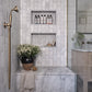 Traditional Francone BTS23 wall-mounted solid brass hand shower with living patina, installed in a marble bathroom by Millie Turner, photo by Sarah Griggs.