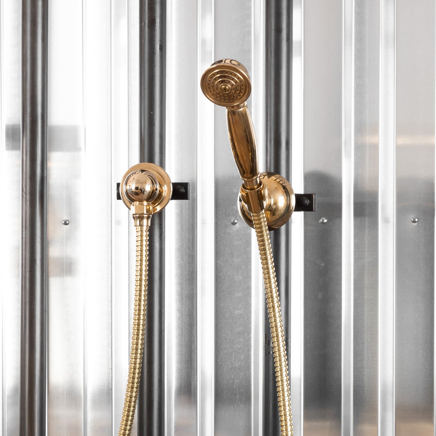 Francone BTS23P wall mounted hand shower and separate outlet in traditional unlacquered brass.