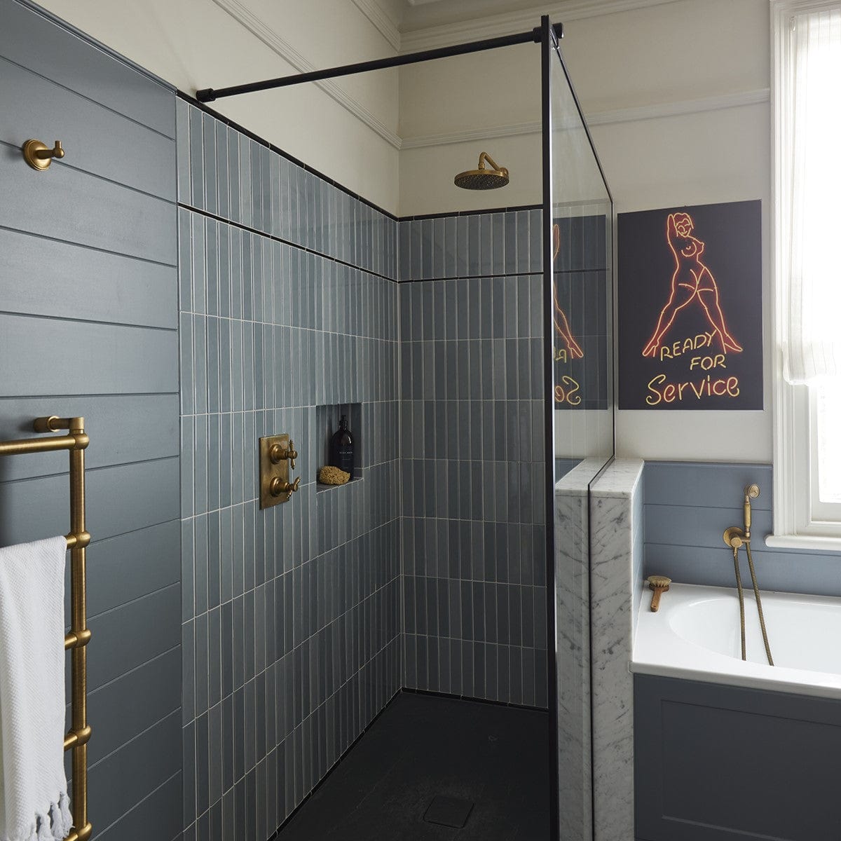 An installed Francone BTS33 unlacquered brass concealed thermostatic shower set with oval backplate in a bathroom.