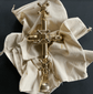 An unlacquered brass Francone BTS3D thermostatic column shower valve with cross handles.