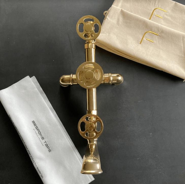 Bespoke Francone BTS3F unlacquered brass bathroom shower and bath faucet with decorative wheel handles.