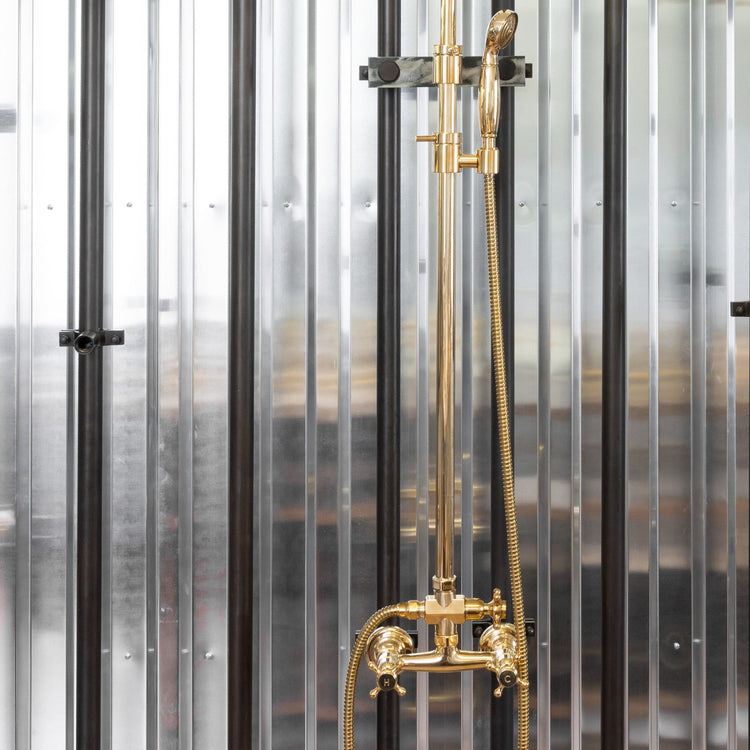 Traditional Francone BTS4 classic adjustable column shower in unlacquered brass with an adjustable hand shower.