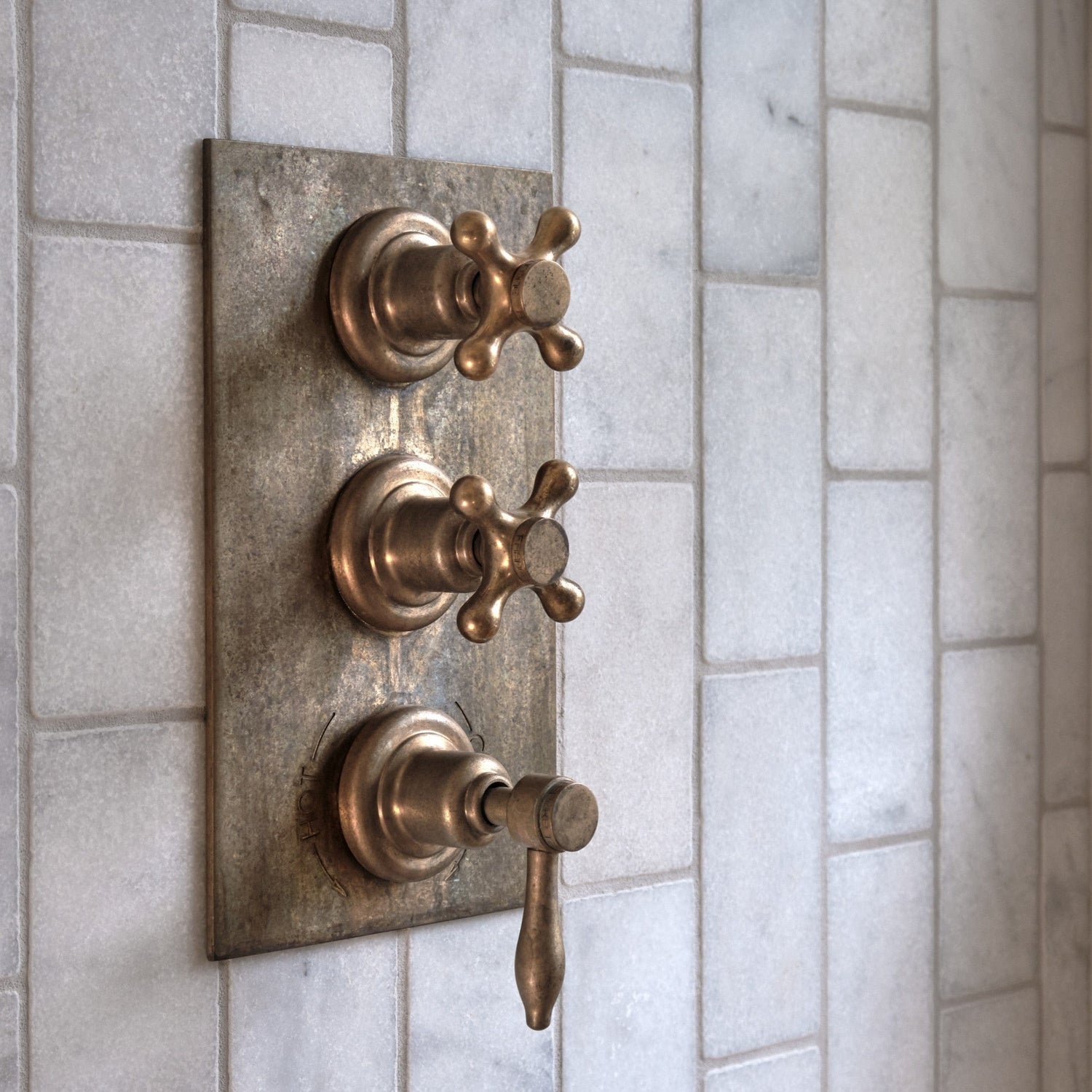 Francone BTS43 traditional thermostatic shower valve in tumbled brass, installed on marble tiles.