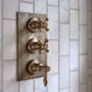 Francone BTS43 traditional thermostatic shower valve in tumbled brass, installed on marble tiles.