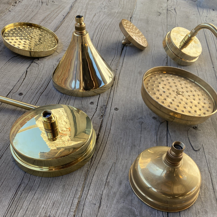 An array of traditional Francone BTS60 solid brass shower head options in unlacquered brass.