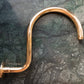 A curved Francone BTSA solid brass shower arm in an elegant unlacquered brass finish.