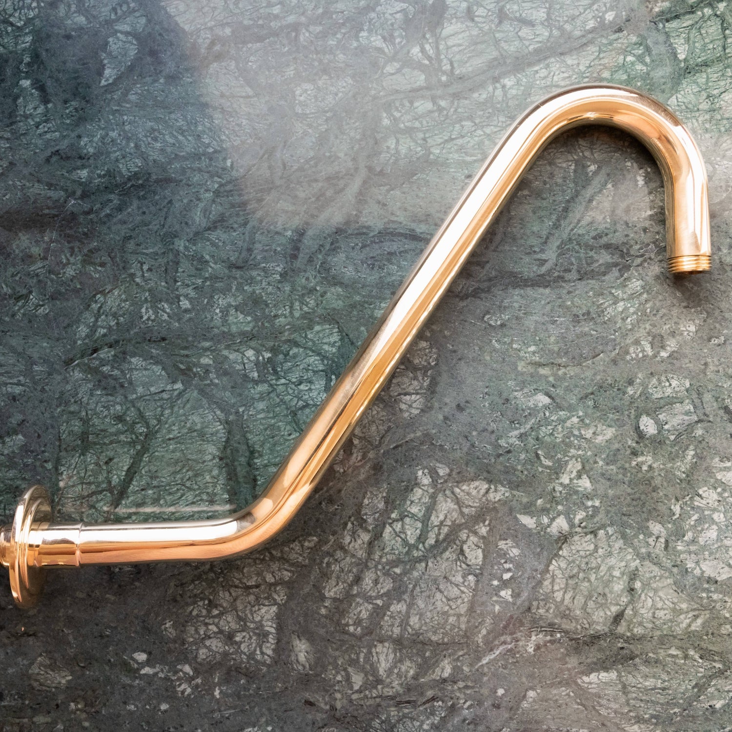A traditional curved Francone BTSA swan shower arm crafted from solid unlacquered brass.