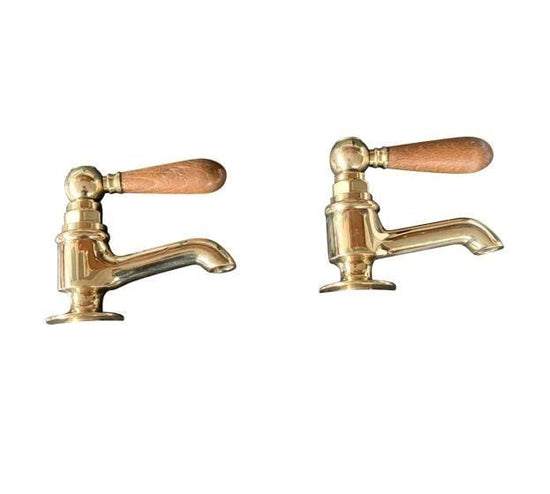 Traditional Francone BT15W unlacquered brass bathroom pillar taps, also a faucet, with wooden levers.