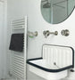 Francone BT20 wall-mounted bathroom faucet with traditional wheel handles, installed above a vintage sink.