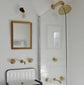 Traditional Francone BT20 solid brass wall-mounted shower faucet and taps installed in a white tiled bathroom.