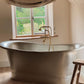 Traditional Francone BT23F solid brass floor-mounted bath filler faucet installed in a bathroom next to a metal tub by Velvet Wellies