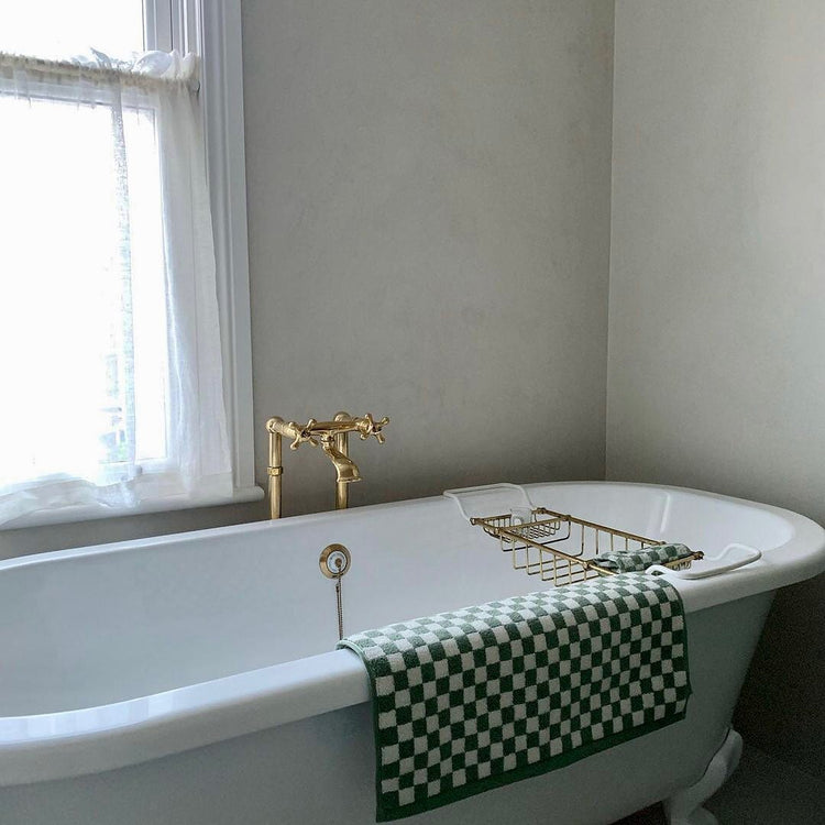 Traditional Francone BT25F solid brass floor mounted bathroom faucet standing beside a clawfoot tub.