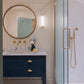 Francone BT34 unlacquered brass bathroom faucet installed above a vanity. Photo by Megan Taylor.