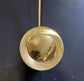 Detail of the circular solid brass pop-up waste plug from the Francone BT37 deck-mounted bathroom tap.