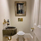 Traditional Francone BT39 unlacquered brass wall mounted faucet fitted in a bathroom above a stone basin.