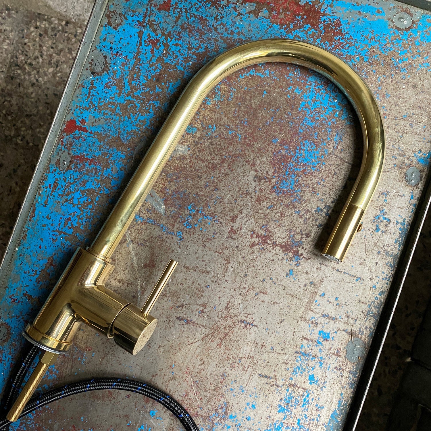 Francone BT98 unlacquered brass kitchen mixer tap with a pull-out spray faucet.