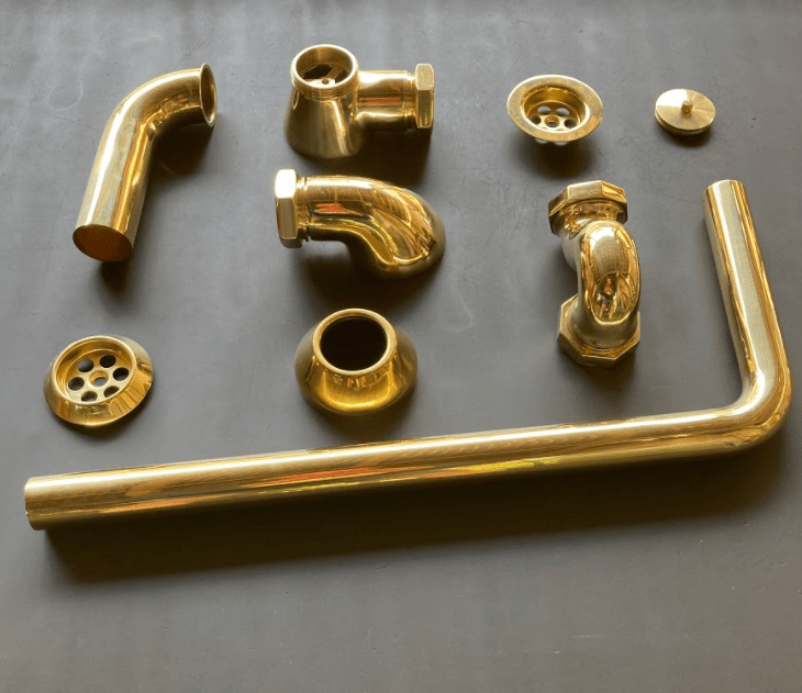 Unassembled components of the Francone BTA10 unlacquered brass bath waste and overflow for exposed bathtubs.