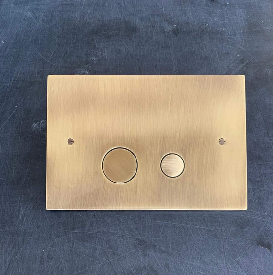 Francone BTA6 toilet dual flush plate for Geberit Sigma in unlacquered satin bronze, styled by Millie Turner.