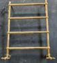 The Francone BTR15 traditional unlacquered brass plumbed heated towel rail with Edwardian details.