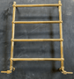 Traditional Francone BTR15 unlacquered brass heated towel rail with lever handles for luxury bathrooms.