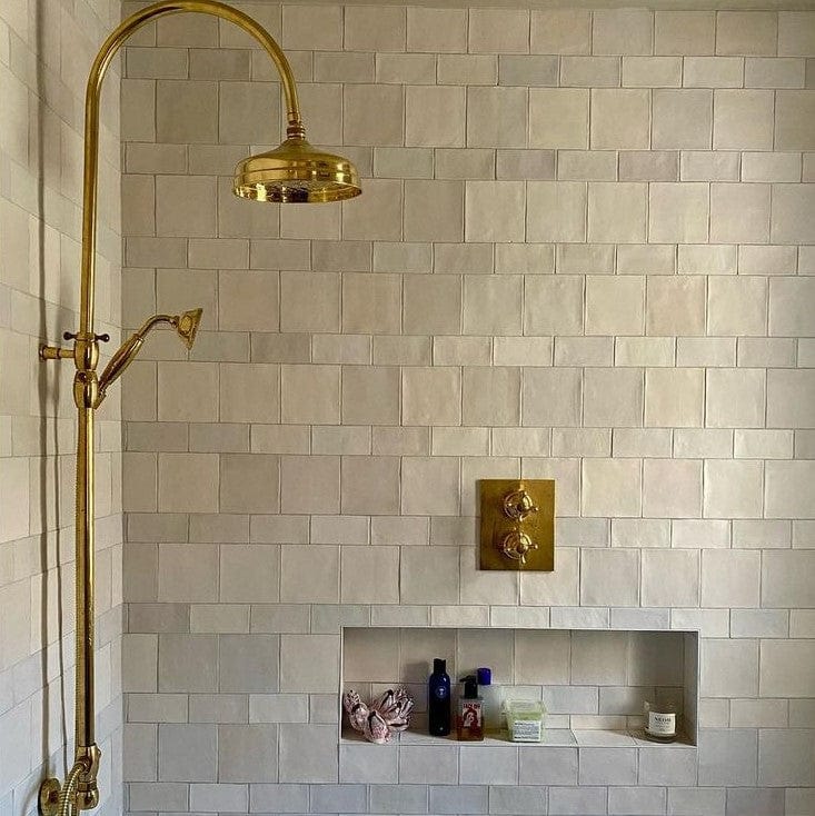 Traditional Francone BTS19 unlacquered brass thermostatic shower column installed in a tiled bathroom by This Bright House.